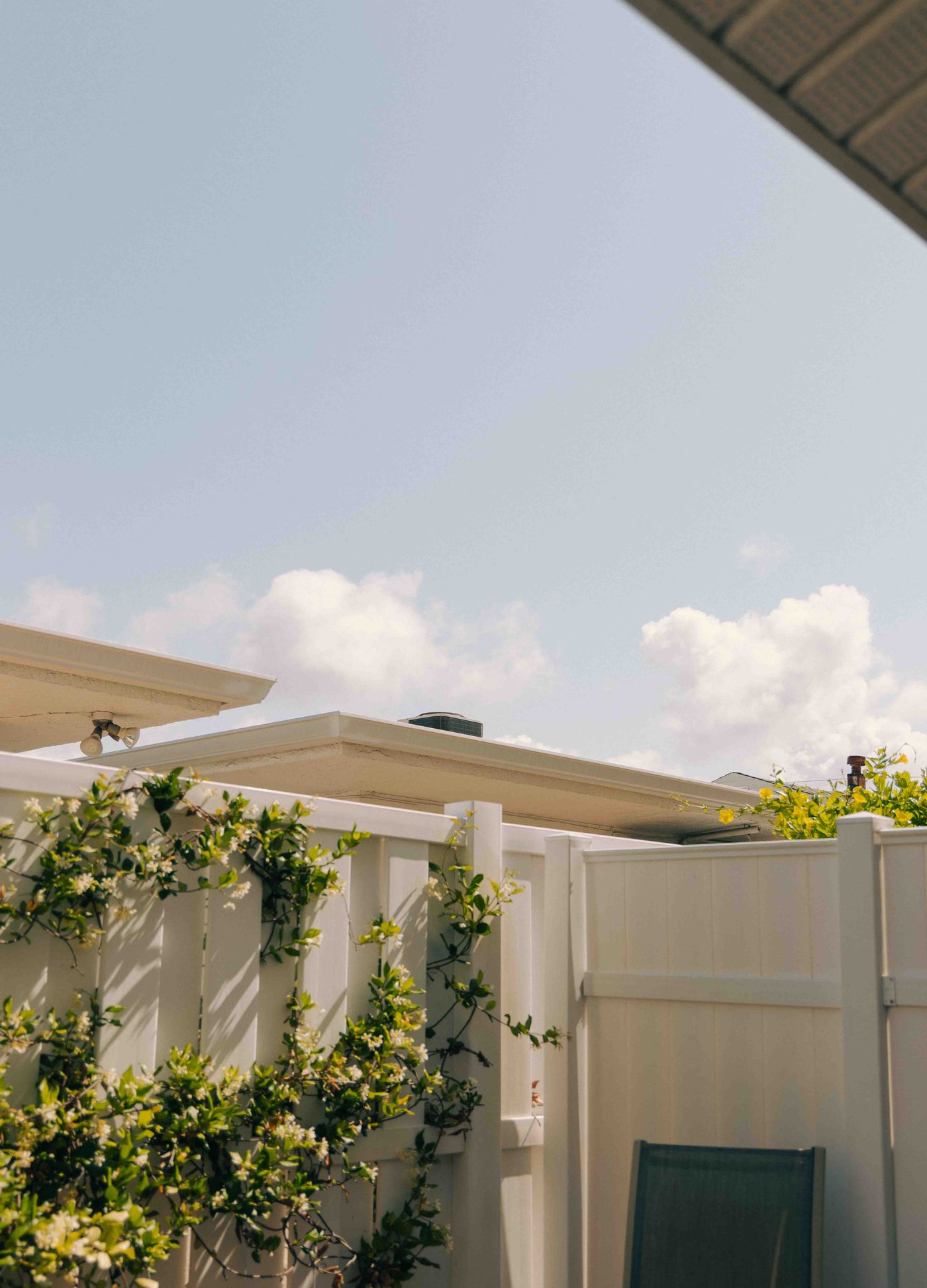 White vinyl fence along a residential property